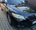 Черный Тойота Камри, объемом двигателя 2.4 л и пробегом 300 тыс. км за 8000 $, фото 1 на Automoto.ua