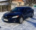 Чорний Тойота Камрі, об'ємом двигуна 2.4 л та пробігом 240 тис. км за 10300 $, фото 1 на Automoto.ua