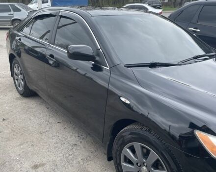 Черный Тойота Камри, объемом двигателя 2.4 л и пробегом 250 тыс. км за 8500 $, фото 1 на Automoto.ua