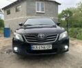 Черный Тойота Камри, объемом двигателя 2.4 л и пробегом 336 тыс. км за 7600 $, фото 1 на Automoto.ua