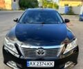 Черный Тойота Камри, объемом двигателя 2.5 л и пробегом 187 тыс. км за 12499 $, фото 1 на Automoto.ua