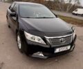 Чорний Тойота Камрі, об'ємом двигуна 2.49 л та пробігом 236 тис. км за 11000 $, фото 1 на Automoto.ua