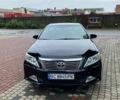 Чорний Тойота Камрі, об'ємом двигуна 2.49 л та пробігом 235 тис. км за 11800 $, фото 1 на Automoto.ua