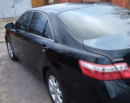Чорний Тойота Камрі, об'ємом двигуна 2.4 л та пробігом 248 тис. км за 10100 $, фото 1 на Automoto.ua