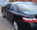 Чорний Тойота Камрі, об'ємом двигуна 2.4 л та пробігом 248 тис. км за 10100 $, фото 1 на Automoto.ua