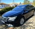 Черный Тойота Камри, объемом двигателя 2.5 л и пробегом 210 тыс. км за 12700 $, фото 1 на Automoto.ua