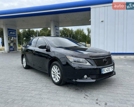 Черный Тойота Камри, объемом двигателя 2.5 л и пробегом 280 тыс. км за 12900 $, фото 1 на Automoto.ua