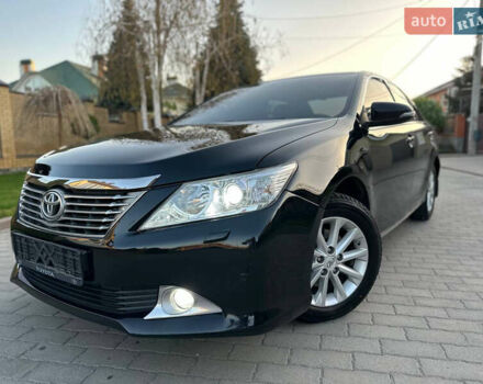 Черный Тойота Камри, объемом двигателя 2.5 л и пробегом 220 тыс. км за 13750 $, фото 1 на Automoto.ua