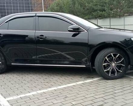 Черный Тойота Камри, объемом двигателя 2.5 л и пробегом 187 тыс. км за 11000 $, фото 1 на Automoto.ua