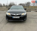 Черный Тойота Камри, объемом двигателя 2.5 л и пробегом 186 тыс. км за 12600 $, фото 1 на Automoto.ua