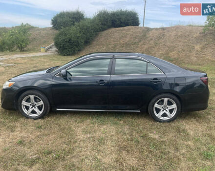 Черный Тойота Камри, объемом двигателя 2.5 л и пробегом 250 тыс. км за 10900 $, фото 2 на Automoto.ua