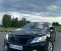 Черный Тойота Камри, объемом двигателя 2.49 л и пробегом 235 тыс. км за 11200 $, фото 1 на Automoto.ua