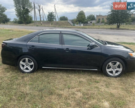 Черный Тойота Камри, объемом двигателя 2.5 л и пробегом 250 тыс. км за 10900 $, фото 1 на Automoto.ua