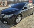 Черный Тойота Камри, объемом двигателя 2.5 л и пробегом 168 тыс. км за 14500 $, фото 1 на Automoto.ua