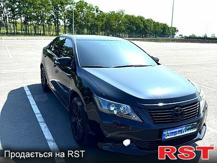 Черный Тойота Камри, объемом двигателя 2.5 л и пробегом 238 тыс. км за 14700 $, фото 1 на Automoto.ua