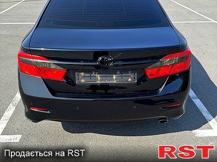 Черный Тойота Камри, объемом двигателя 2.5 л и пробегом 238 тыс. км за 14700 $, фото 2 на Automoto.ua