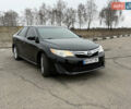 Черный Тойота Камри, объемом двигателя 2.5 л и пробегом 186 тыс. км за 12600 $, фото 1 на Automoto.ua