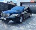Черный Тойота Камри, объемом двигателя 2.49 л и пробегом 176 тыс. км за 12400 $, фото 1 на Automoto.ua