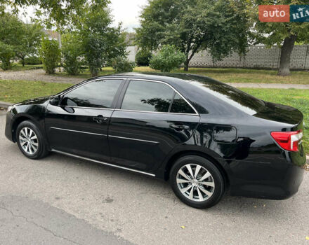 Черный Тойота Камри, объемом двигателя 2.5 л и пробегом 155 тыс. км за 12000 $, фото 1 на Automoto.ua