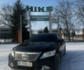 Черный Тойота Камри, объемом двигателя 2.49 л и пробегом 230 тыс. км за 15000 $, фото 1 на Automoto.ua