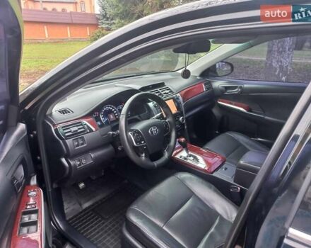 Черный Тойота Камри, объемом двигателя 2.5 л и пробегом 127 тыс. км за 15700 $, фото 1 на Automoto.ua