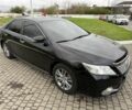 Черный Тойота Камри, объемом двигателя 2.5 л и пробегом 200 тыс. км за 9900 $, фото 1 на Automoto.ua