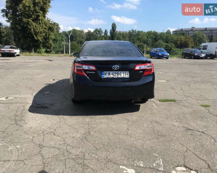Черный Тойота Камри, объемом двигателя 2.5 л и пробегом 280 тыс. км за 12500 $, фото 1 на Automoto.ua
