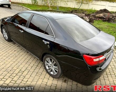 Черный Тойота Камри, объемом двигателя 2.5 л и пробегом 200 тыс. км за 9900 $, фото 2 на Automoto.ua