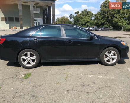 Черный Тойота Камри, объемом двигателя 2.5 л и пробегом 280 тыс. км за 12500 $, фото 2 на Automoto.ua
