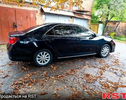 Чорний Тойота Камрі, об'ємом двигуна 2.5 л та пробігом 250 тис. км за 13500 $, фото 1 на Automoto.ua