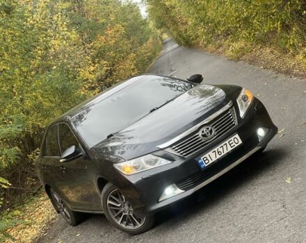 Черный Тойота Камри, объемом двигателя 2.5 л и пробегом 280 тыс. км за 12100 $, фото 1 на Automoto.ua