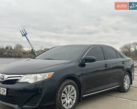 Черный Тойота Камри, объемом двигателя 2.49 л и пробегом 170 тыс. км за 10500 $, фото 1 на Automoto.ua