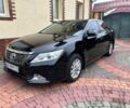 Черный Тойота Камри, объемом двигателя 2.5 л и пробегом 215 тыс. км за 12800 $, фото 1 на Automoto.ua