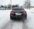 Черный Тойота Камри, объемом двигателя 2.5 л и пробегом 97 тыс. км за 14200 $, фото 1 на Automoto.ua