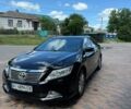 Чорний Тойота Камрі, об'ємом двигуна 2.5 л та пробігом 257 тис. км за 12590 $, фото 1 на Automoto.ua