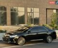 Черный Тойота Камри, объемом двигателя 2.49 л и пробегом 220 тыс. км за 15900 $, фото 1 на Automoto.ua