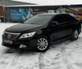 Черный Тойота Камри, объемом двигателя 2.5 л и пробегом 178 тыс. км за 13790 $, фото 1 на Automoto.ua