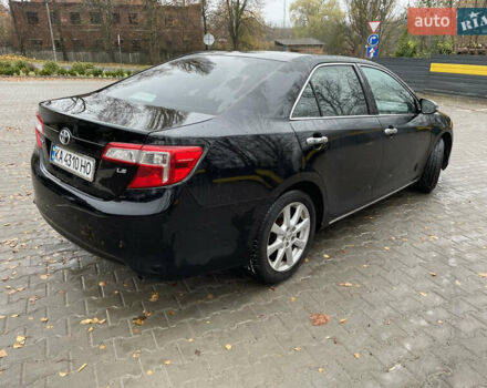 Черный Тойота Камри, объемом двигателя 2.5 л и пробегом 140 тыс. км за 10900 $, фото 1 на Automoto.ua