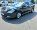 Черный Тойота Камри, объемом двигателя 2.49 л и пробегом 180 тыс. км за 13500 $, фото 1 на Automoto.ua