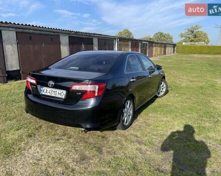 Черный Тойота Камри, объемом двигателя 2.5 л и пробегом 130 тыс. км за 11500 $, фото 1 на Automoto.ua
