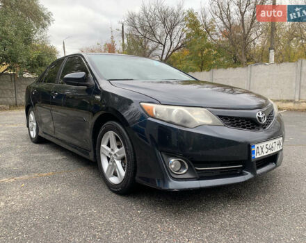 Черный Тойота Камри, объемом двигателя 2.49 л и пробегом 198 тыс. км за 11300 $, фото 1 на Automoto.ua