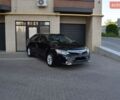 Черный Тойота Камри, объемом двигателя 2.5 л и пробегом 157 тыс. км за 15850 $, фото 1 на Automoto.ua