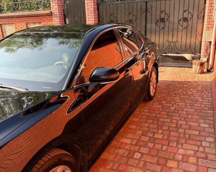 Черный Тойота Камри, объемом двигателя 2.49 л и пробегом 260 тыс. км за 19400 $, фото 1 на Automoto.ua