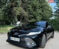 Черный Тойота Камри, объемом двигателя 2.49 л и пробегом 127 тыс. км за 28300 $, фото 1 на Automoto.ua