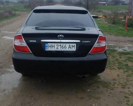 Черный Тойота Камри, объемом двигателя 2.4 л и пробегом 290 тыс. км за 7000 $, фото 1 на Automoto.ua