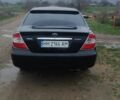 Черный Тойота Камри, объемом двигателя 2.4 л и пробегом 290 тыс. км за 7000 $, фото 1 на Automoto.ua