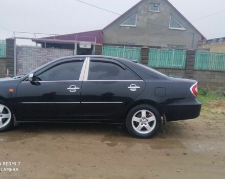 Черный Тойота Камри, объемом двигателя 2.4 л и пробегом 290 тыс. км за 7000 $, фото 4 на Automoto.ua