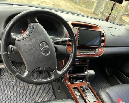 Черный Тойота Камри, объемом двигателя 2.4 л и пробегом 250 тыс. км за 6500 $, фото 1 на Automoto.ua