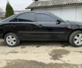 Черный Тойота Камри, объемом двигателя 2.4 л и пробегом 250 тыс. км за 6500 $, фото 1 на Automoto.ua