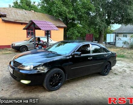 Черный Тойота Камри, объемом двигателя 3 л и пробегом 290 тыс. км за 4300 $, фото 1 на Automoto.ua